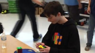 Boy completes Rubik's cube