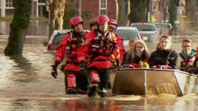 Residents being rescued by boat