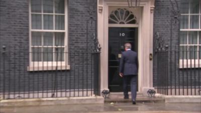 David Cameron walking back into Downing Street