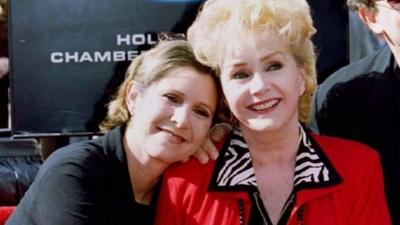 Actress Debbie Reynolds poses with her daughter actress Carrie Fisher