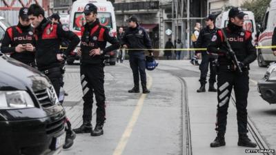 Police secure the area following a suicide bombing in a major shopping and tourist district