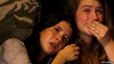 Two teenage girls in Jerusalem crying as they mourn girl stabbed to death at a Gay Pride march last week