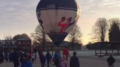 Hot air balloon lands at Bassingbourn Primary School