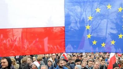 Protesters attend an anti government demonstration in Warsaw