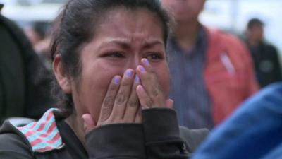 Woman reacts to earthquake damage