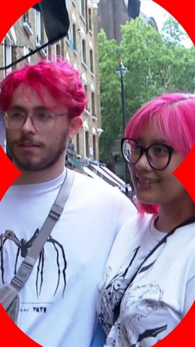 BBC's culture reporter Noor Nanji speaks to a couple with pink hair