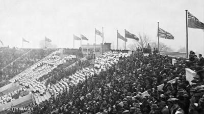 As president of the event, Edward, Prince of Wales, asks his father, King George V, to open the proceedings. 