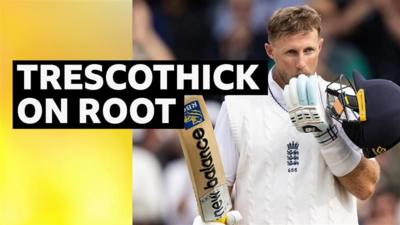 Joe Root kissing his bat