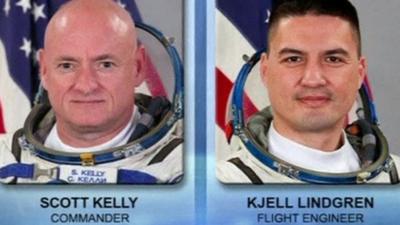 Two astronauts take their first spacewalk from the ISS