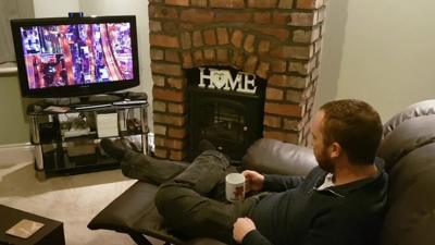 A researcher from the Lancaster University watching television and using the Matchpoint control system