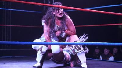 Women performing in the ring at Wrestle Queendom