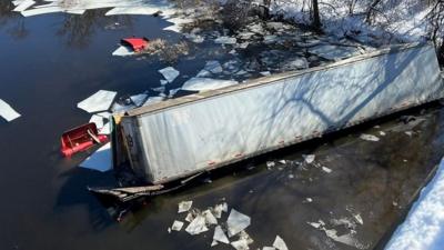 Watch the moment a tractor-trailer plunged 50ft into the water after crashing off a bridge.