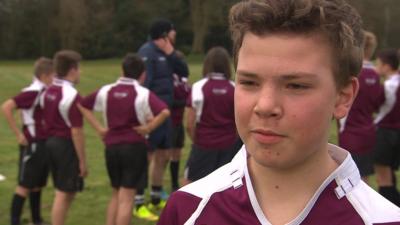 Kids talking about tackling in rugby