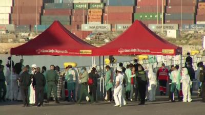 Migrants being checked by Spanish officials in Valencia