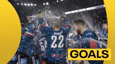 Belfast Giants players celebrate with the Elite League trophy