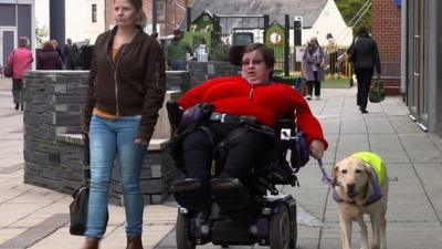 Cecilia Kenny in a wheelchair with her dog