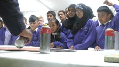 Pupils from Billesley Primary School with Mohammed Ali