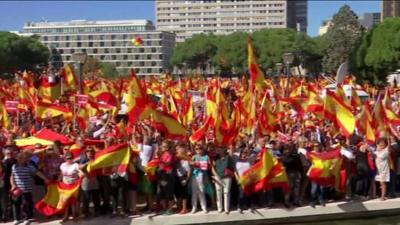 Campaigners wave Spanish flags at pro-unity event in Madrid