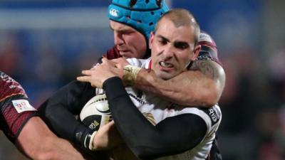 Dragons forward Ben White battles with Ulster's Ruan Pienaar at Kingspan Stadium