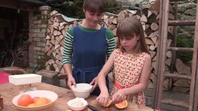 Flora makes marmalade.