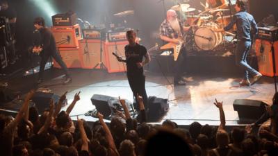 Eagles of Death Metal perform on stage on 13 November 2015 at the Bataclan concert hall in Paris