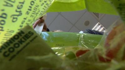 Man packing a shopping bag