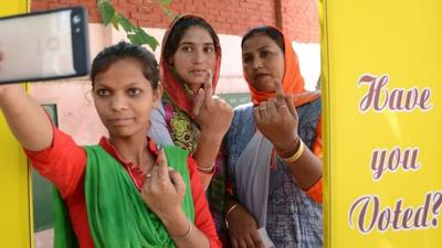 Voters pose for a selfie