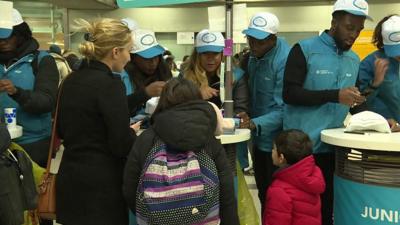 Children get ready to board a train in Paris on 22 December 2019