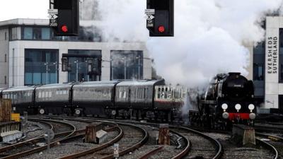 Prince Charles arrives by steam train