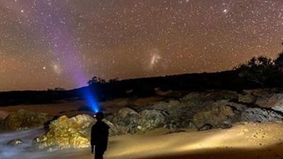 A person against a clear night sky in Australia