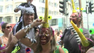 Revellers at carnival, dressed at the Zika-carrying mopsquito