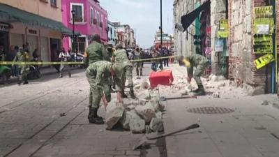 Soldiers clear rubble