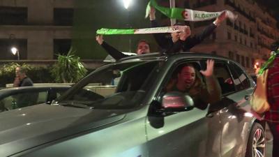 People celebrate in car in Algiers