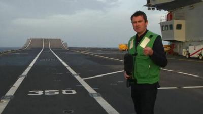 Ed Thomas on board aircraft carrier