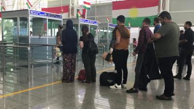 People queuing in airport