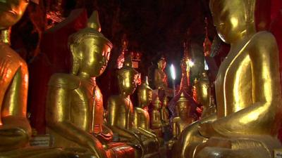 Statues of Buddha line the wall of Pindaya Cave