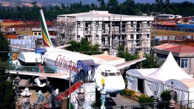 Ethiopian airlines passenger plane in the middle of a town