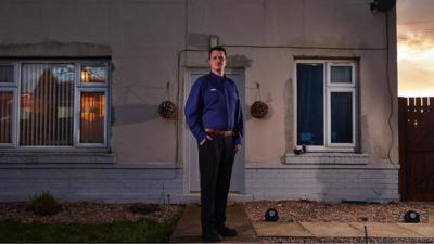 Picture of worker outside home