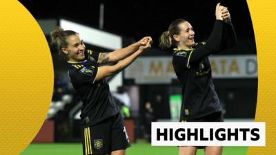 Julia Zigiotti Olme and Elisabeth Terland celebrate in black Man Utd kit