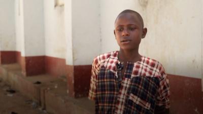 Abdulhadi Abubaka outside his school