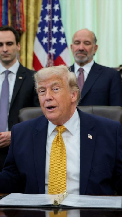 Donald Trump wearing a gold tie