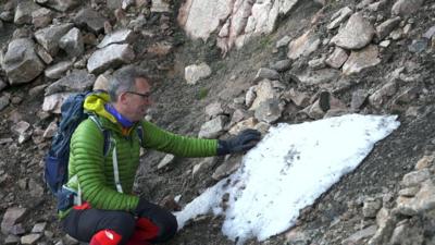 Researcher Ian Cameron and the snow patch