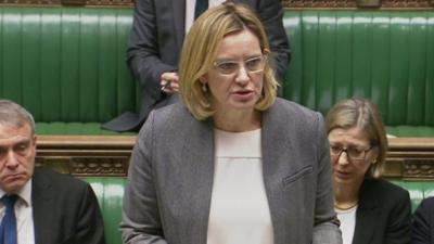 The home secretary says she is "proud" of the UK's "active approach" to protecting vulnerable child migrants following criticisms of the government.