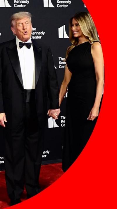 Donald and Melania Trump standing in formal outfits