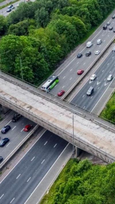 Drone shot of a bridge over a motorway.