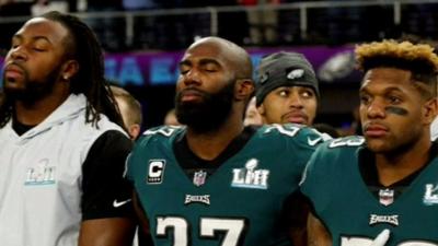 Black players standing during the US national anthem