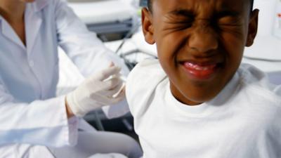 Child receiving injection