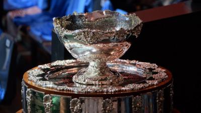 A picture shows the Davis Cup trophy