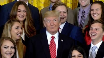 The president is not amused during a photo shoot with outgoing White House interns.