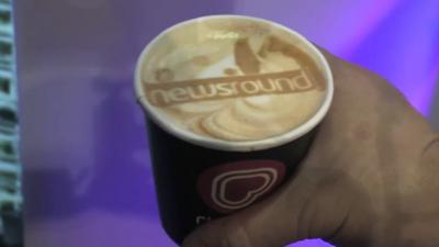 Drink of coffee with Newsround logo printed on top